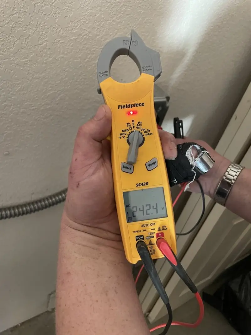 Voltage testing with clamp meter during Ceiling Fan Installation in Ellenton